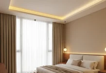 Thiết kế nội thất phòng ngủ master – Tổ ấm riêng tư chuẩn sang trọng Phòng ngủ master với cửa sổ lớn, ánh sáng vàng dịu và bố cục hiện đại tối giản